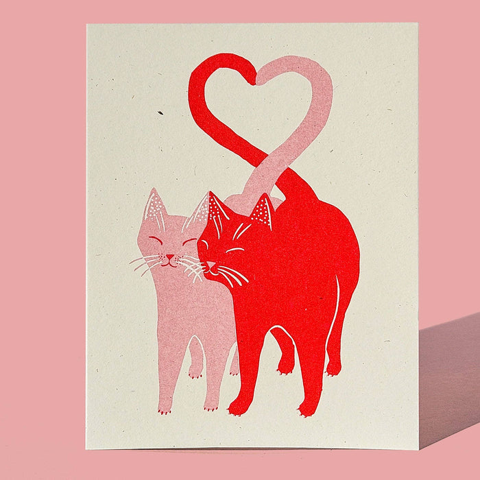 Pink and red Love Cats Risograph greeting card by Bromstad Printing Co. featuring playful cat illustrations on textured paper