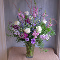 tall and elegant floral arrangement with roses, lisianthus, stock, and natural accents by Michler's Florist in Lexington, KY