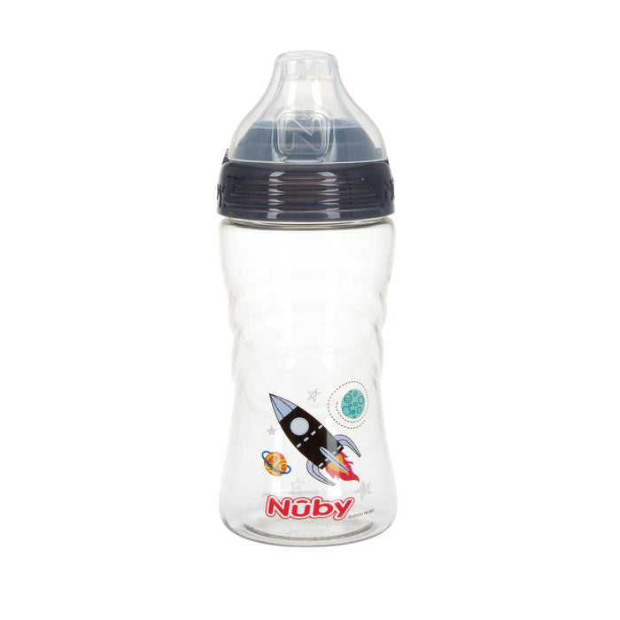 The Nuby Thirsty Kids Sip It Sport Beginner Travel Cup (Rocket, Grey) is a clear plastic baby bottle with a black lid, soft silicone sippy top, rocket and space designs, and features a No-Spill spout for mess-free drinking. Brand name appears in red near the bottom.